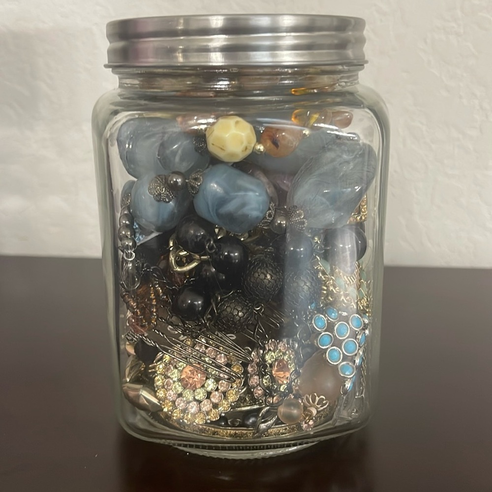 Surprise jar filled with costume jewelry.